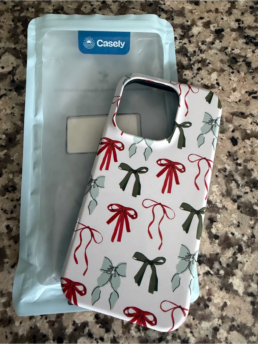 Casely White Phone Case with Red & Green Bow Pattern - IPhone 14 Pro